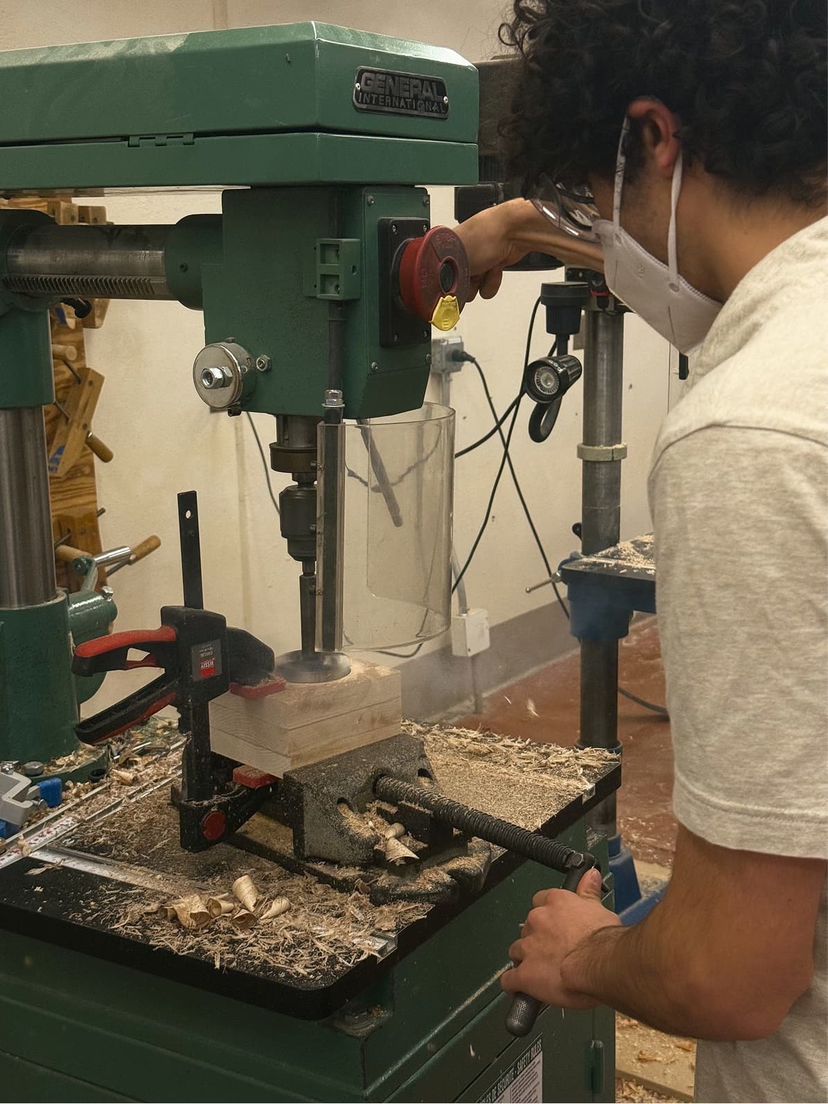 Drilling the maple block on a drill press using three sizes of bits.